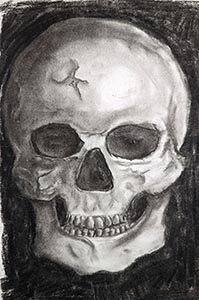 A human skull in charcoal with multiple cracks